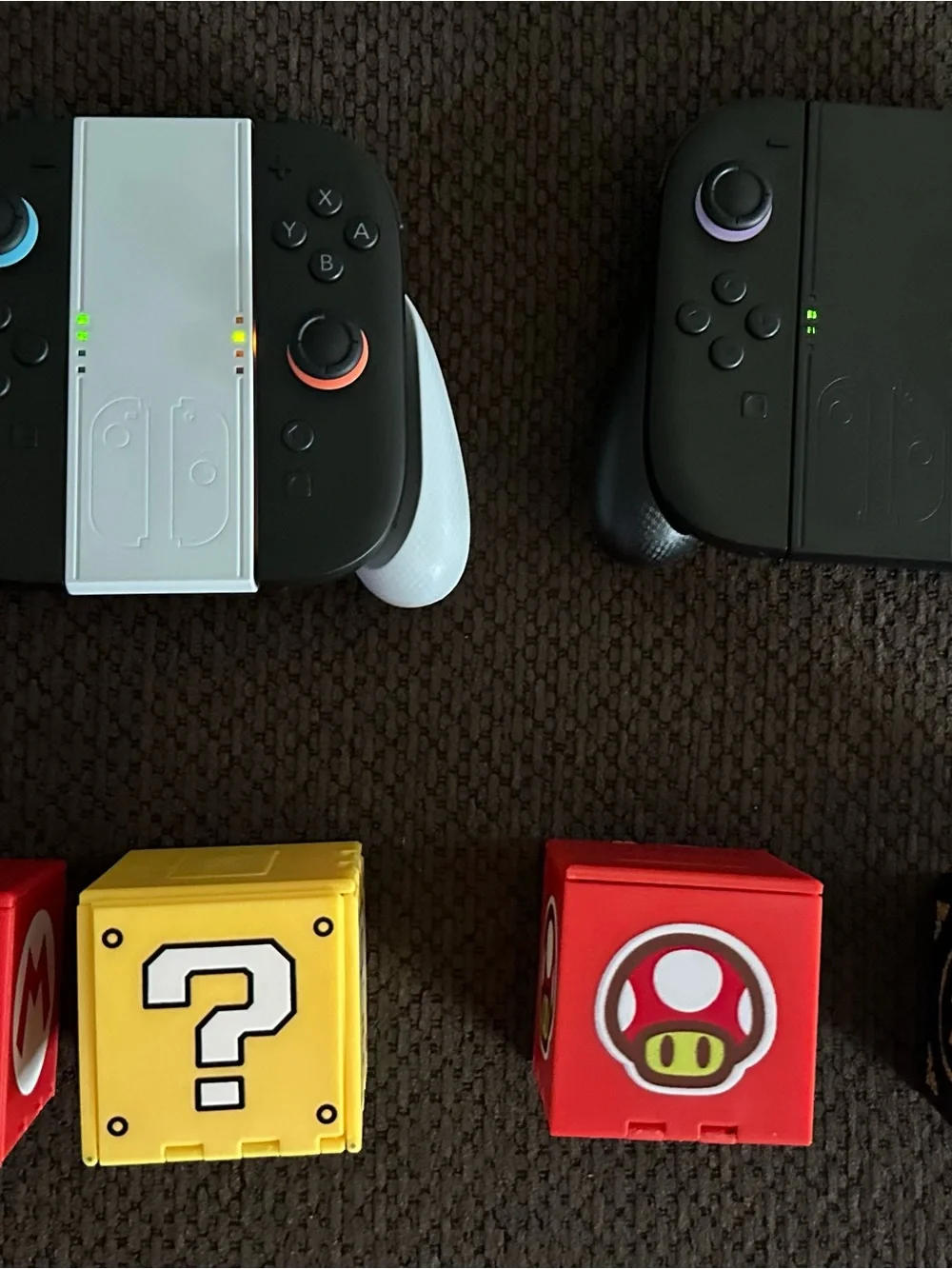 Nintendo Joy-Con Pair with White Grip and Red/Yellow Mario Blocks/Zelda black